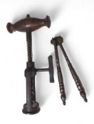 A 19th Century corkscrew with shaped wood handle s
