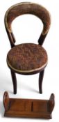 An oak book stand with folding ends together with