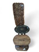 An African carved hardwood birthing stool, with de
