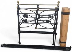 A 20th century iron and brass bed frame with woode