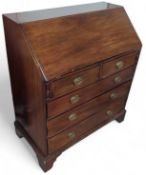A 19th century mahogany bureau with fall front abo