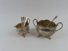 A silver two-handled silver sugar bowl, a silver c