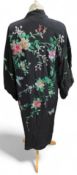 A 20th Century silk embroidered kimono, worked wit