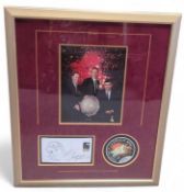 A framed and glazed display featuring an image of