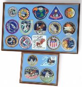 Two framed glazed displays of embroidered patches