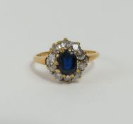 A mid-20th century sapphire and diamond cluster ring