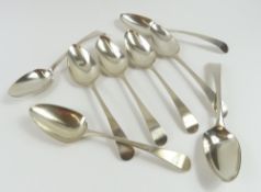 Eight silver serving spoons of similar if not iden
