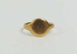 An 18ct gold signet ring, the round shaped head wi