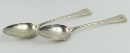 A pair of Georgian silver serving spoons with engr