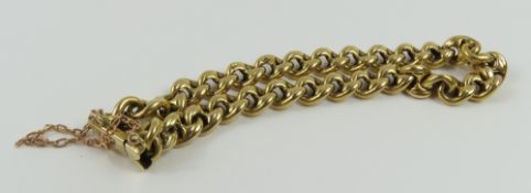 A thick figure of eight type link bracelet, each l