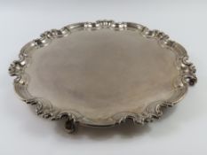 A large silver salver with smooth plate and perpet