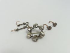 An 18th or 19th century paste circlet brooch, the