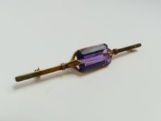 A mid-20th century amethyst set bar brooch, the la