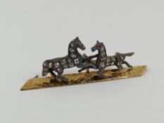 An unusual 19th century brooch, with two rearing h