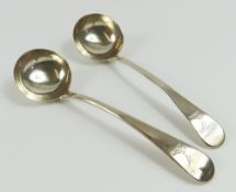 Two identical Georgian silver sauce ladles