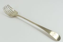 A large silver serving fork