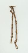 A 9ct rose gold alternating trombone and double knot link double Albert chain