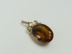 A large Edwardian citrine and split pearl pendant,