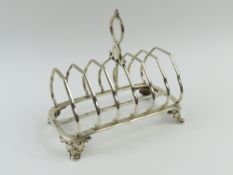 A Victorian silver toast rack, with dividers round