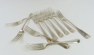 Nine identical silver table forks alongside one other
