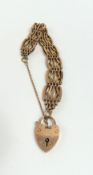 A rose gold fancy link gate bracelet, the central