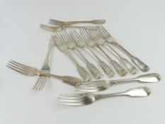 Twelve matched George IV Exeter silver fiddle pattern table forks