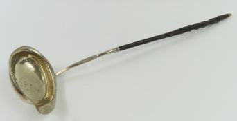 A Georgian silver toddy ladle with twisted handle.