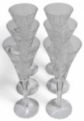 A set of six Waterford crystal champagne flutes, p
