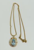 A pendant set with a pear shaped blue topaz, 2.5cm