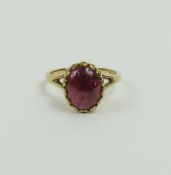 A 9ct gold cabochon cut garnet ring, finger size K