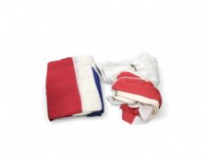 Two large flag-pole flags, comprising the red cros