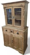 A modest pine side cabinet
