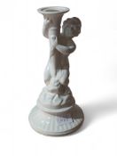 A Beswick white glazed candleholder supported by a