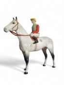 A Beswick figure of a pied jockey upon a dapple-gr