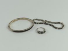 A black and white diamond ring, the stones claw se