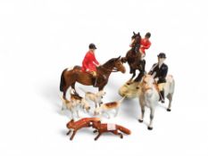 A Beswick figure of a woman upon a dapple-grey hor