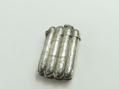 A silver vesta case, shaped as four rods, curved a