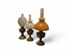 Three brass oil lamps with glass shades (3)