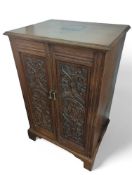 A modern pseudo-18th-century stained-oak cabinet