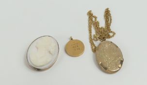 A white/very light pink shell cameo pendant, the m