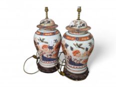 A pair of large Imari palette baluster vases with