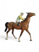 A Beswick figure of a pied jockey riding a trottin