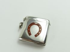 A silver vesta case, of smooth and curved form, wi