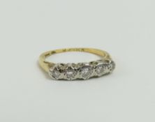 A diamond five stone ring, marked '18', finger siz