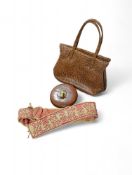 A vintage crocodile handbag along with an antique tape measu