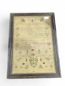 A 19th Century sampler worked in coloured wools wi