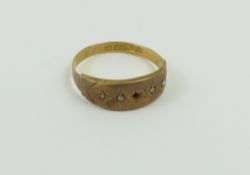 A Victorian 15ct gold ring set with four small ros