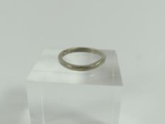 A plain wedding band, marked 'PLAT', finger size J