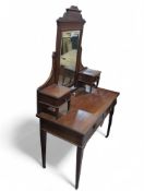 A 20th-century mahogany dressing table with centra