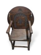 A contemporary stained-oak monk's chair